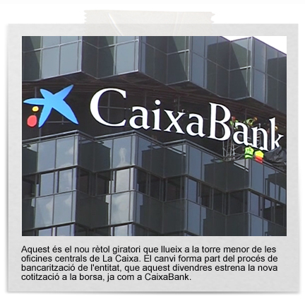 El nou rètol giratori sobre una de les torres de La Caixa | bancs, caixes, La Caixa